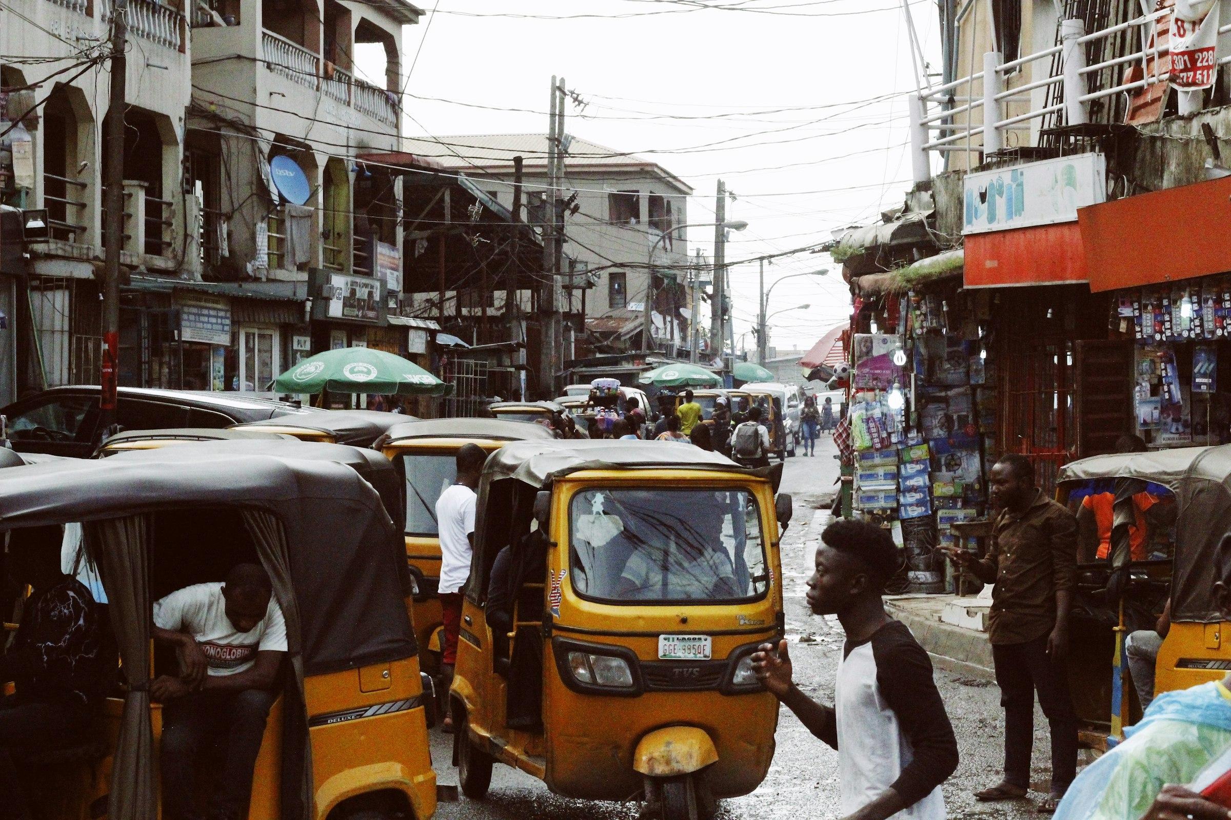 Busy Lagos street — everyday West African conditions often addressed in UK tribunal country evidence